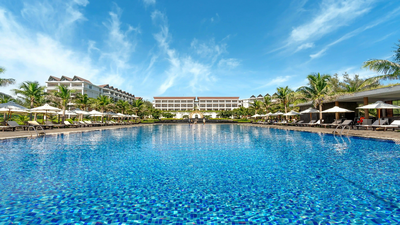 Hotel pool umbrella an sunbed